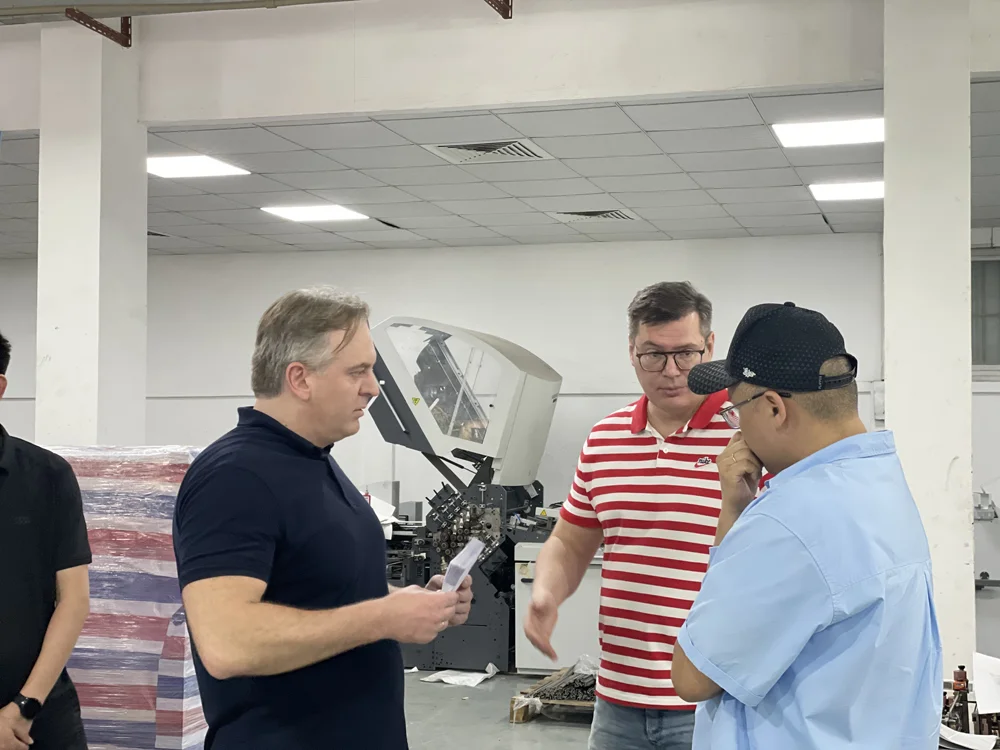 Pharmaceutical packaging client touring SPEED Machinery folding machine factory